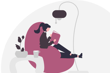 Ragazza che legge su una comoda poltrona